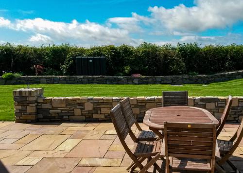 stone wall, pillar and patio