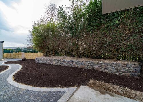 Garden Landscaping with Stone Wall